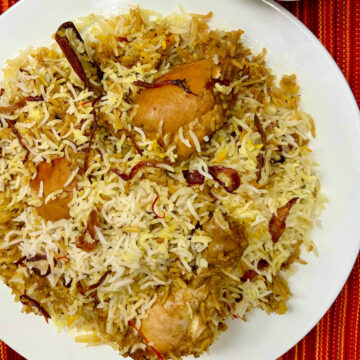 plate of jerk chicken dum biryani