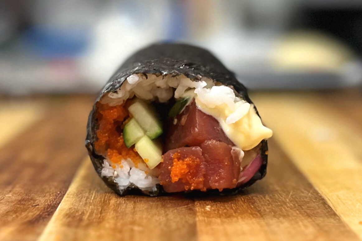 side view of a rolled sushi burrito