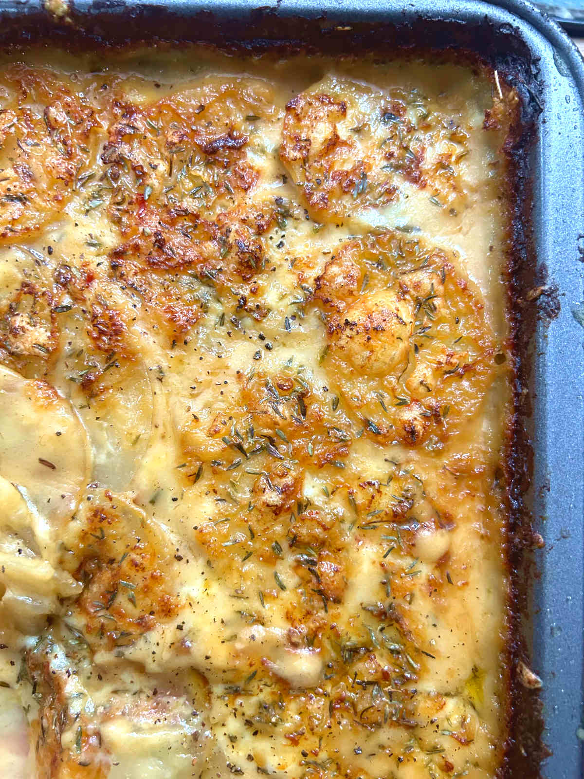 top view of potatoes au gratin in a baking tray