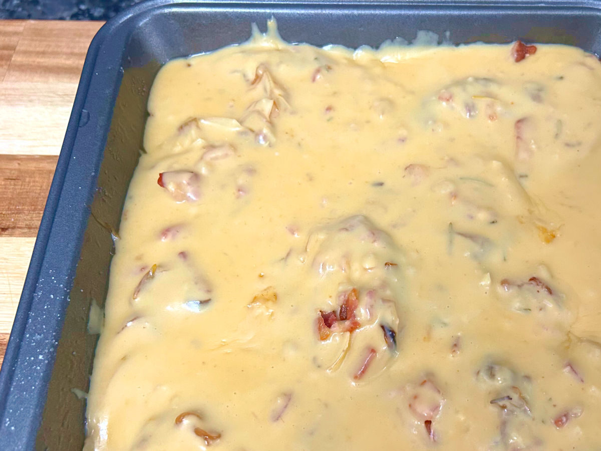 baking dish with a top layer of cheesy sauce