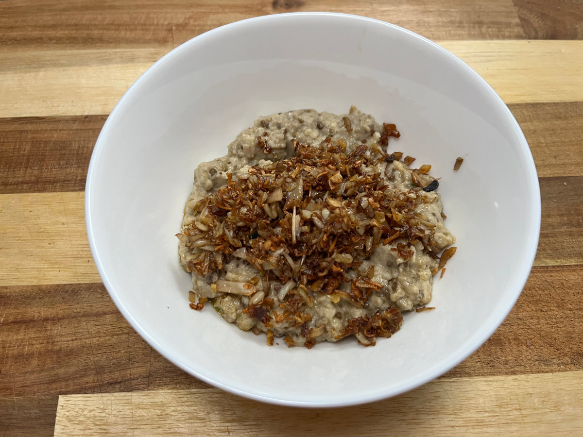mixture of baba ganoush with sautéed garlic and mushroom stems in a bowl
