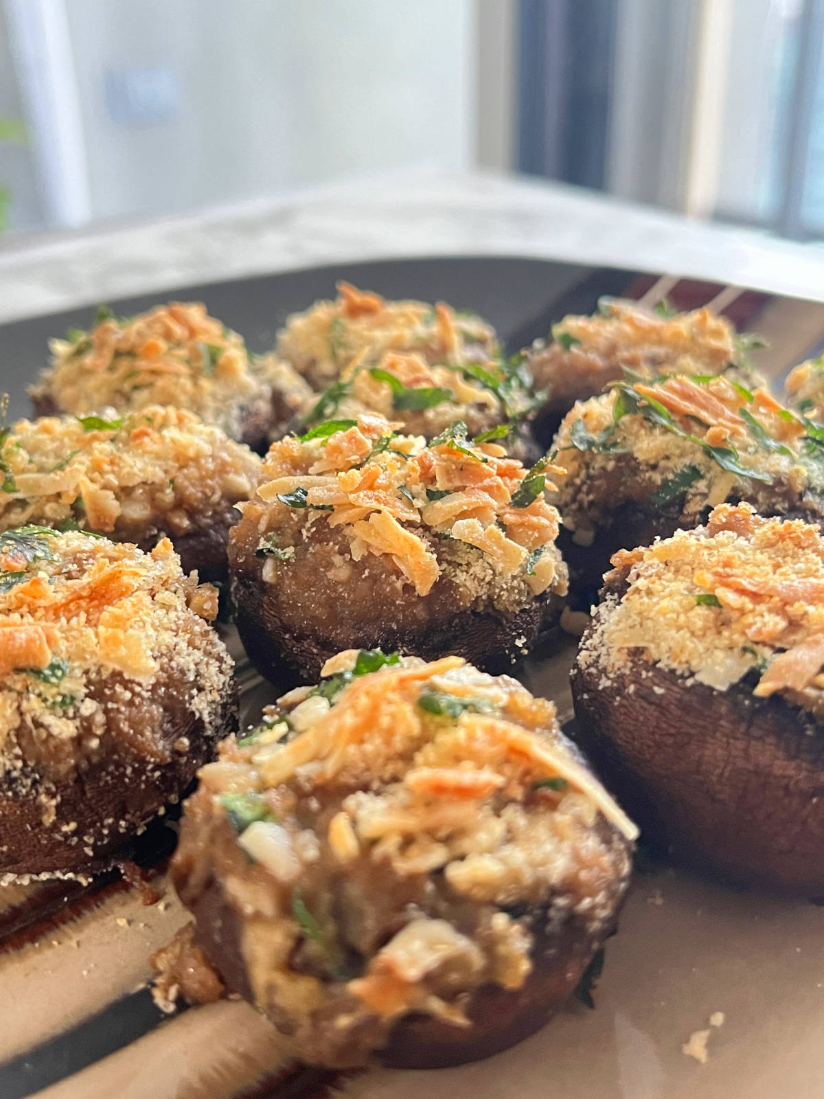 10 baba ganoush stuffed mushrooms on a plate