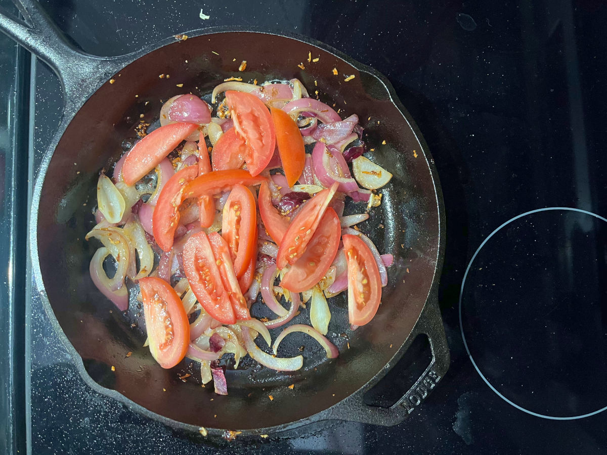 garlic, onions and tomatoes in a skillet