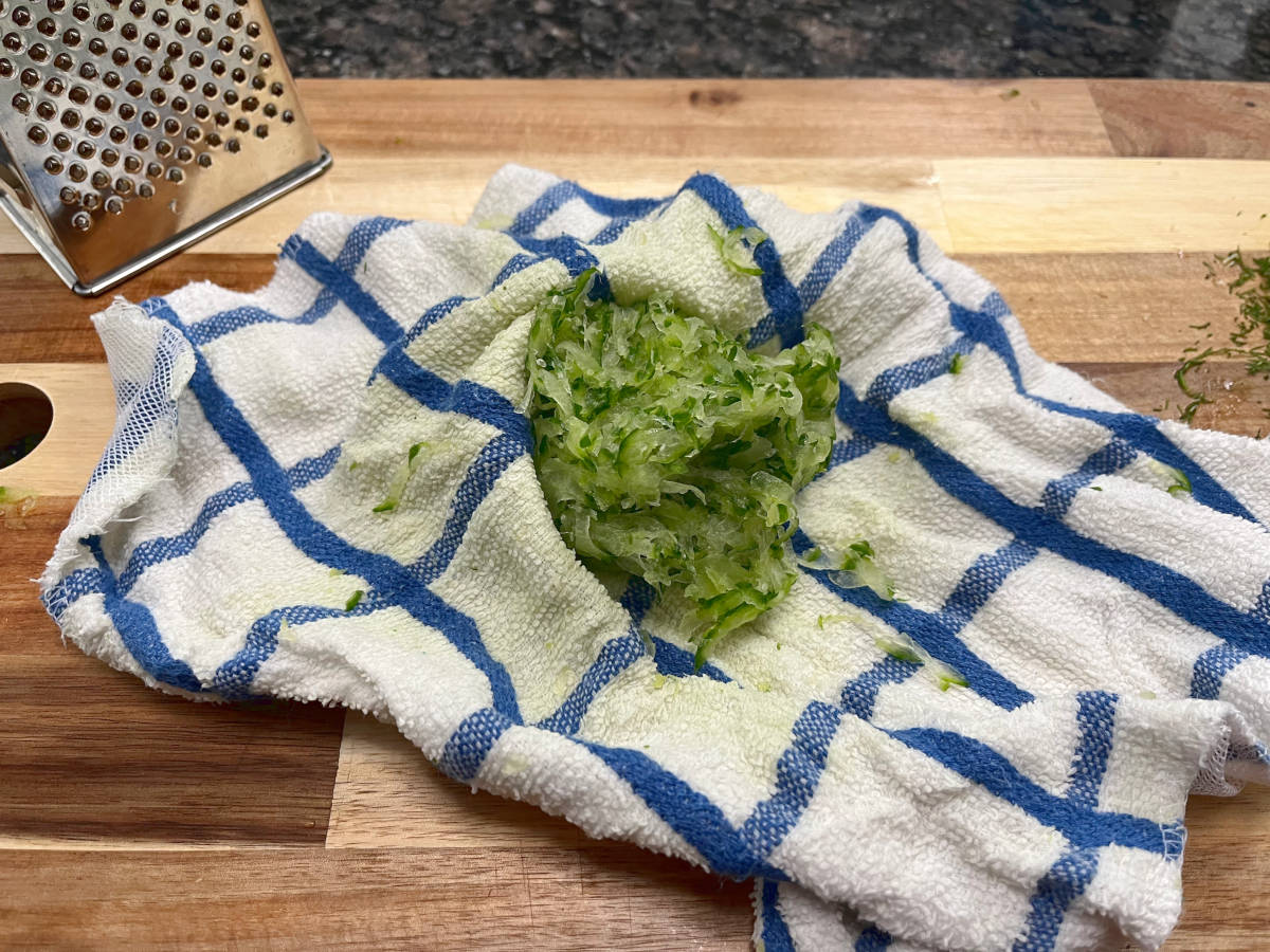 Squeezed out grated cucumber in a cloth.