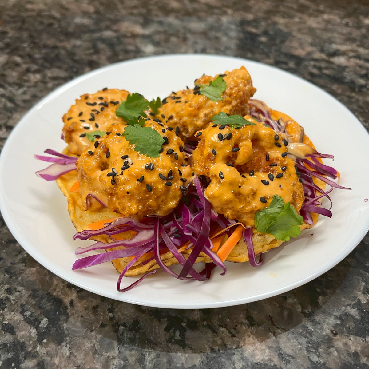 Prawn thai curry tostadas on a plate