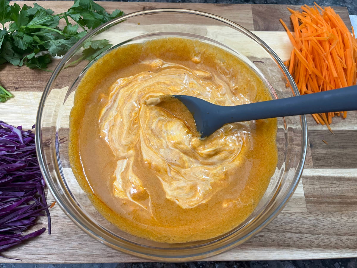 Thai curry sauce mixed with mayonnaise in a bowl