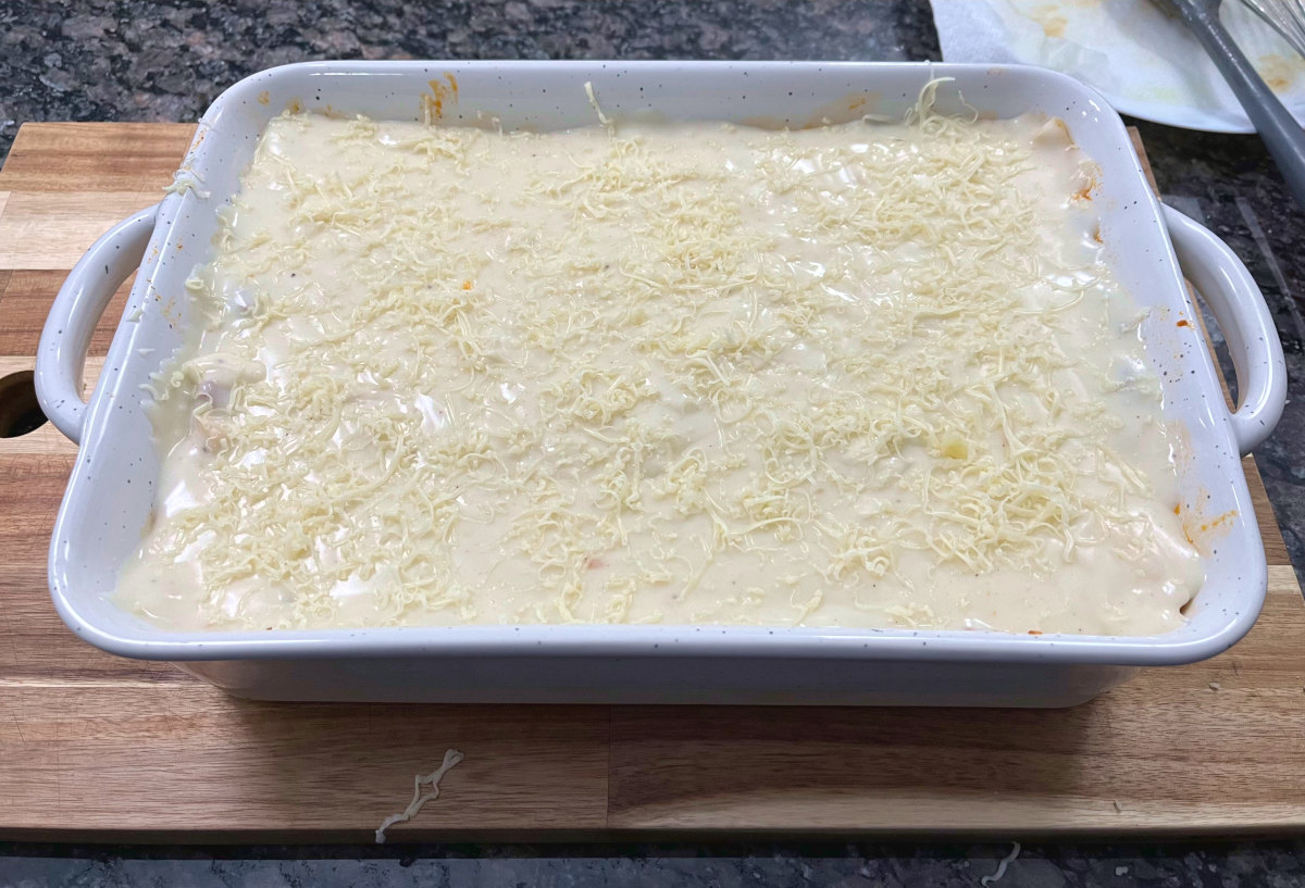 béchamel sauce layer in a casserole dish