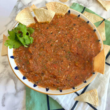 Roasted tomato salsa in a bowl with chips