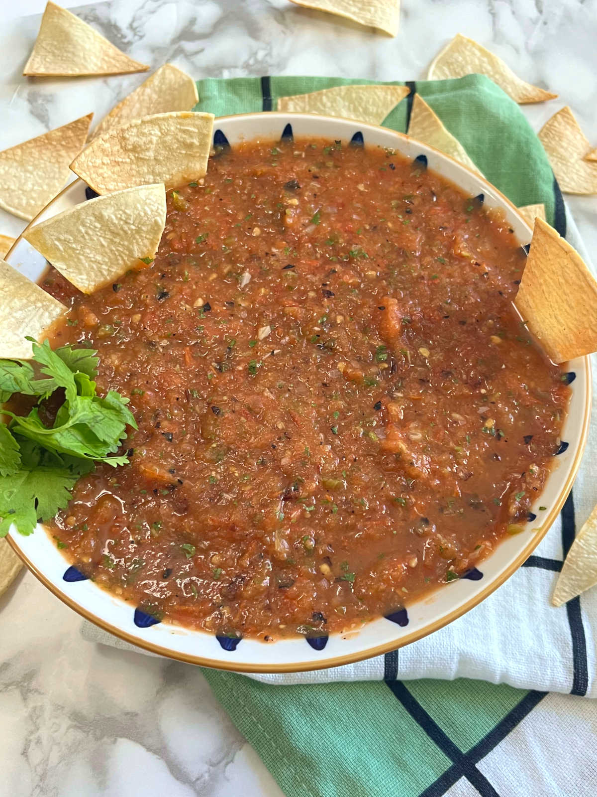 Roasted tomato salsa in a bowl with chips