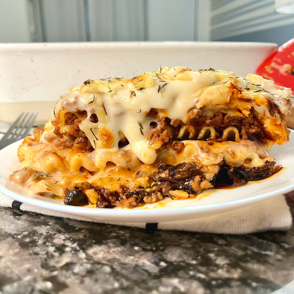 slice of Greek moussaka lasagna displaying all its layers