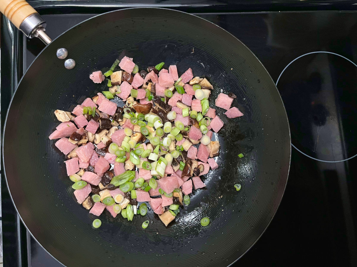 chopped ingredients frying in a wok