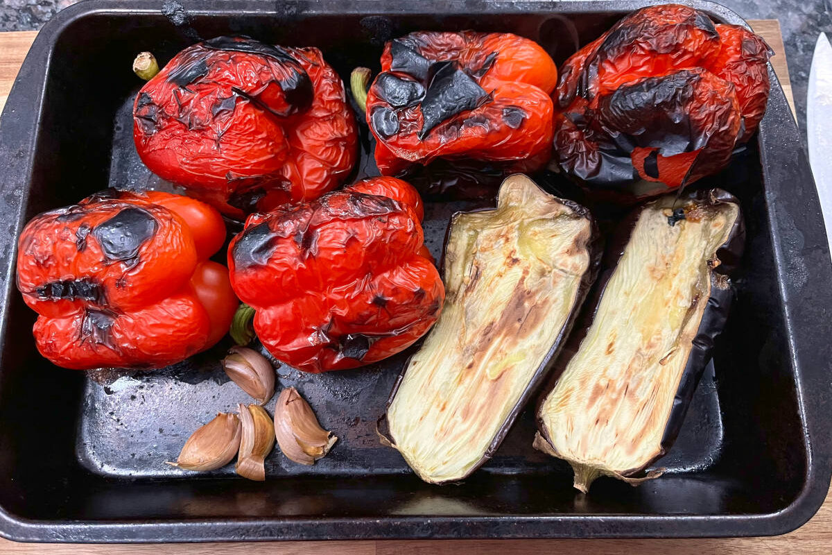 broiled bell peppers, eggplant and garlic in a baking tray