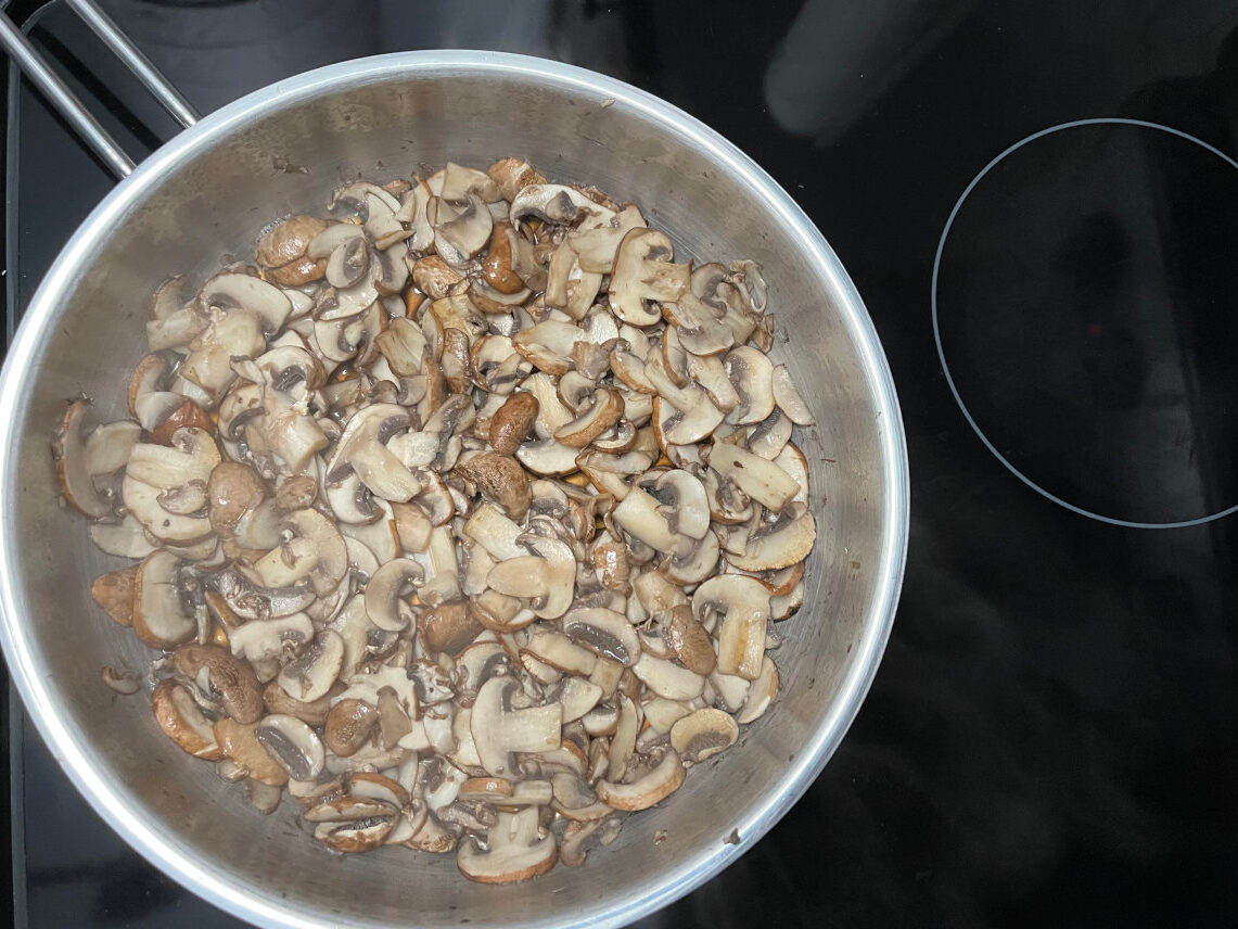 mushrooms cooking in a pan