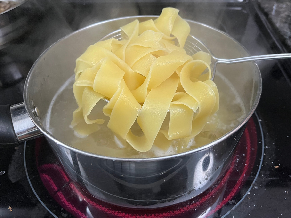 pappardelle cooking in a pan