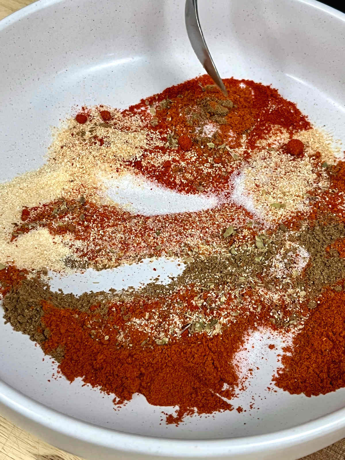 mixing the ingredients to make fajita seasoning