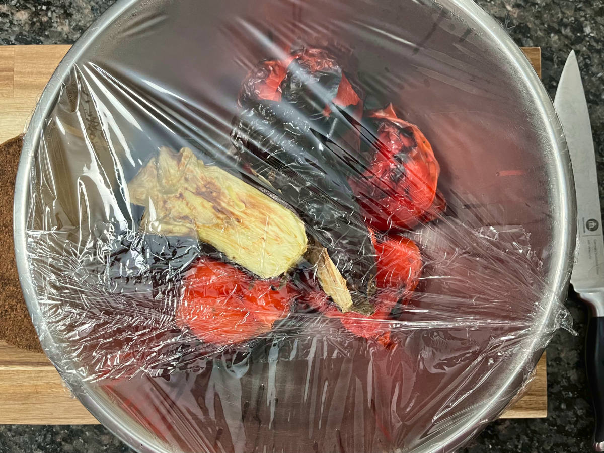 bell peppers, eggplant and garlic steaming in a bowl