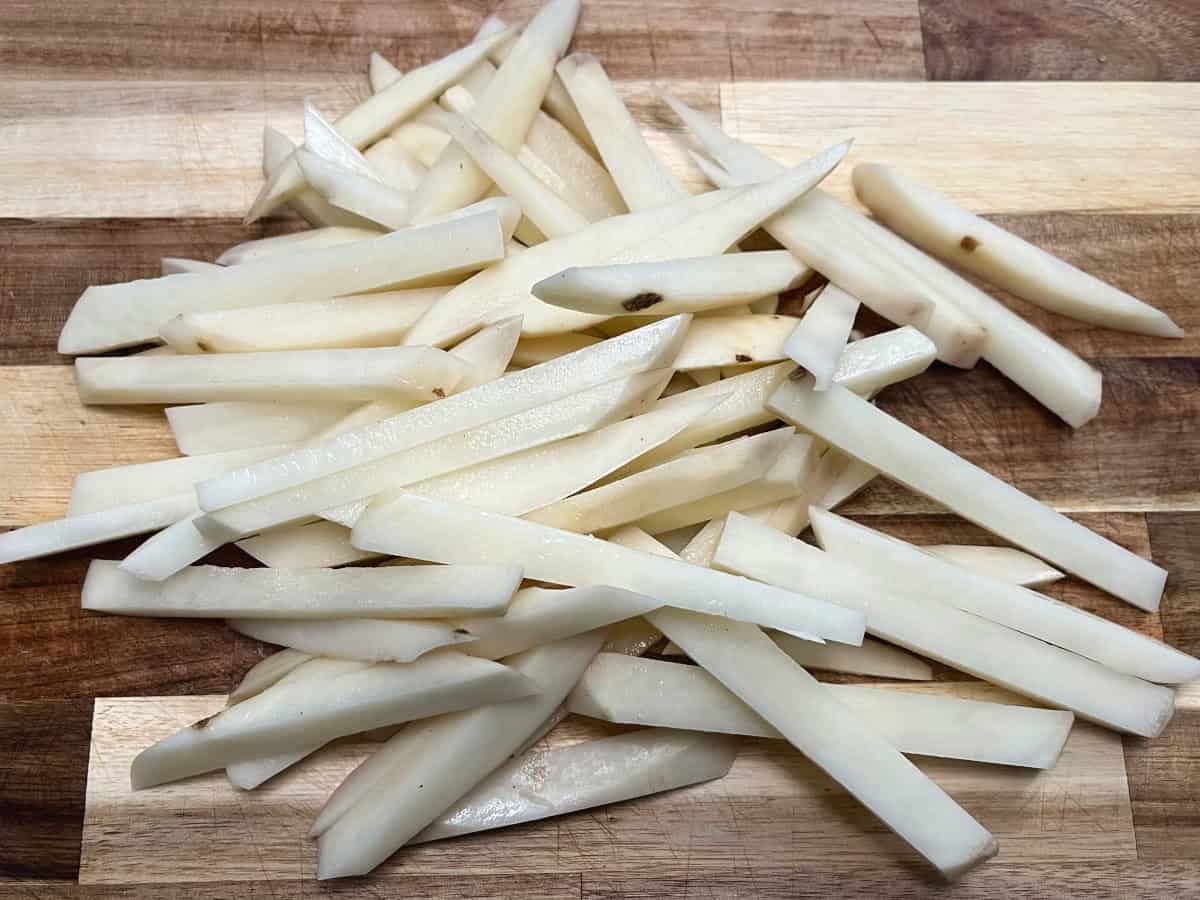 cut potatoes on a cutting board