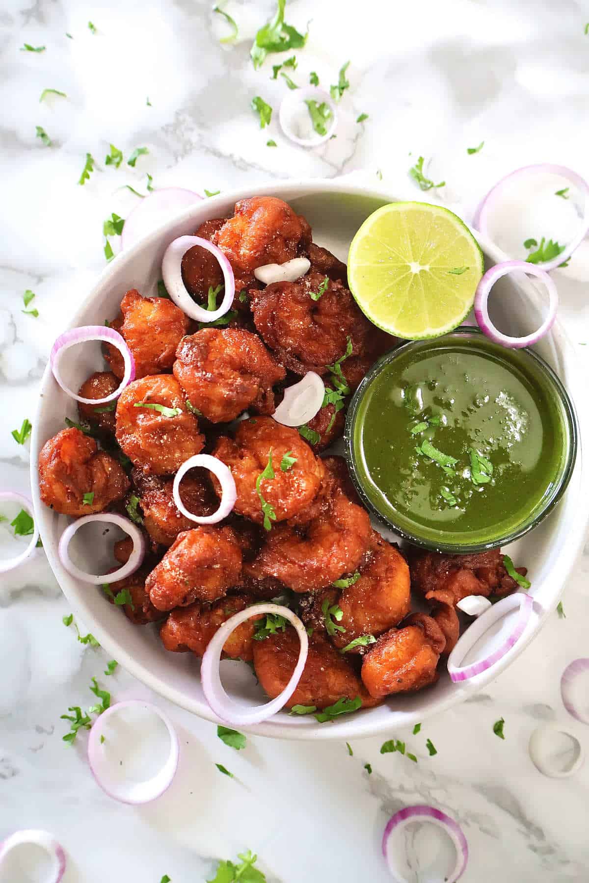Prawn Koliwada with green chutney and lime wedge